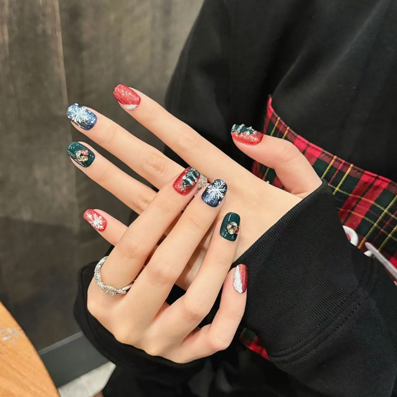 red glitter nails Christmas trees adorned with golden beads