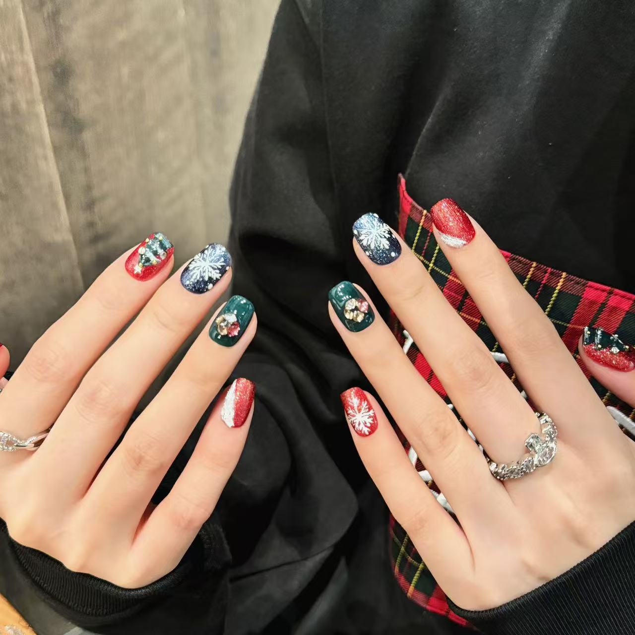 red glitter nails Christmas trees adorned with golden beads